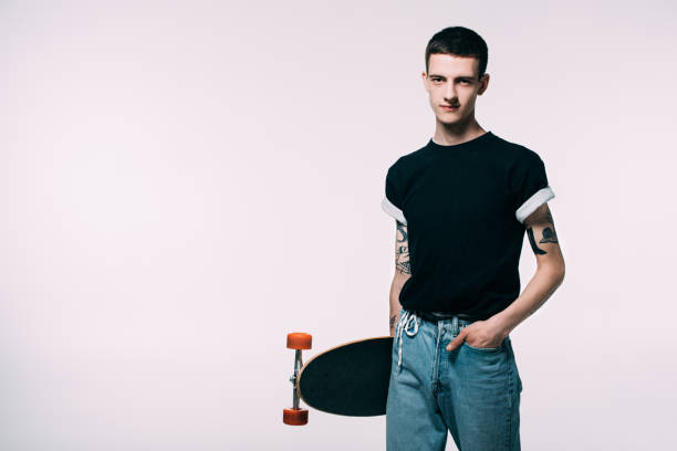 istock Hipster young man holding longboard isolated on white 971076082