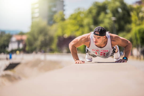 istock Young athletic man working out and expressing determination 971076204