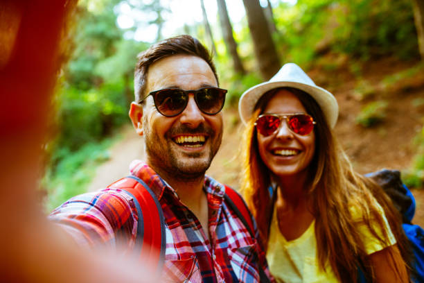 istock Couple hiking and taking selfies 971080234