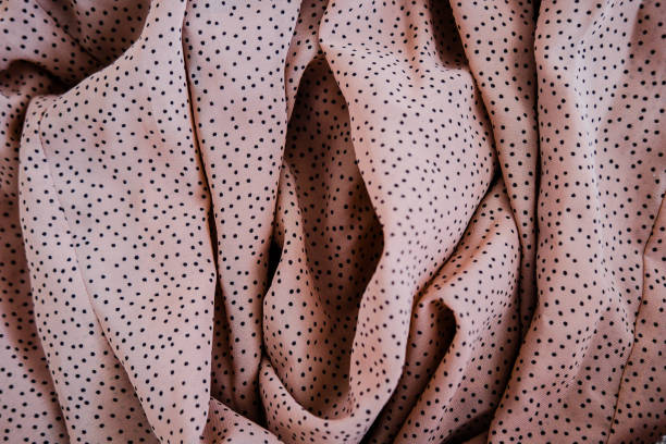 Vagina made of nude color silk fabric stock photo