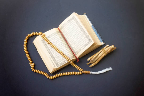 istock prayer beads, siwak, and quran islamic book 971101802