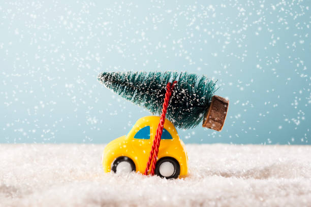 istock Christmas tree on yellow toy car 971132942
