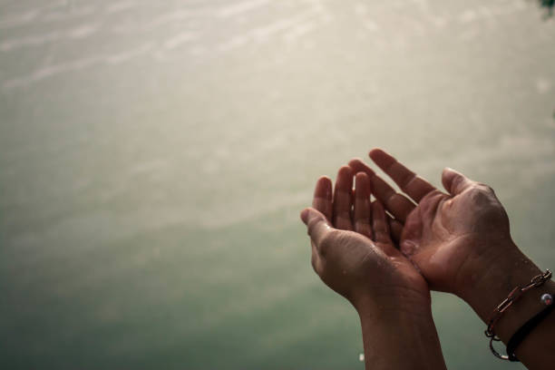 istock Close-Up Of Cropped Wet Hands 971153728