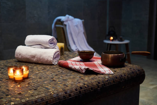 istock Spa and wellness setting with Rolled spa towels 971163844