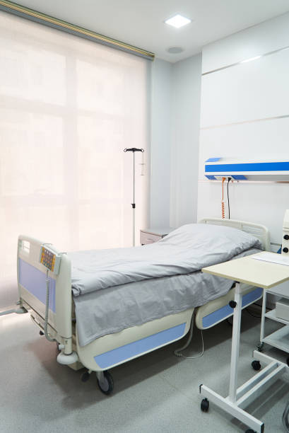 istock Empty Bed On Hospital Ward 971169382