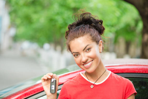 istock woman driver holding showing car keys her new 971195470