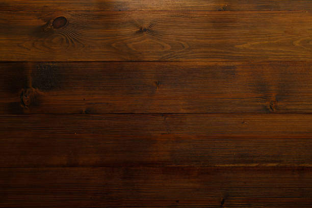 istock Dark brown wooden background with horizontal planks 971198826