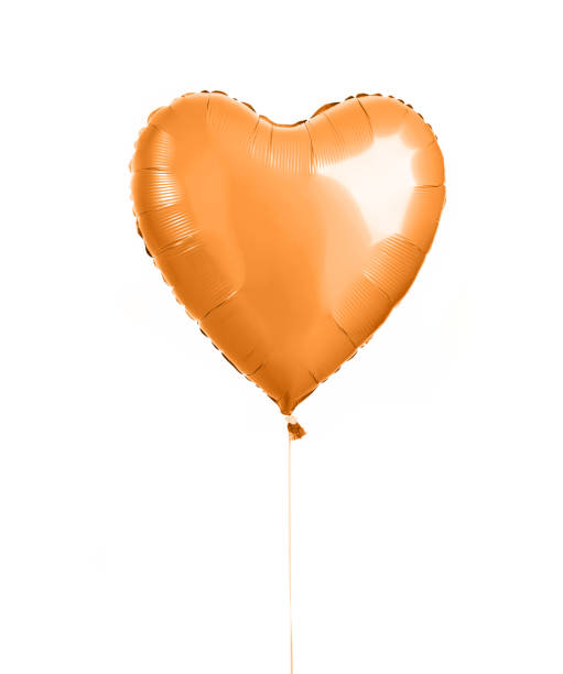 istock Orange heart balloon object for birthday party isolated on a white 971212332