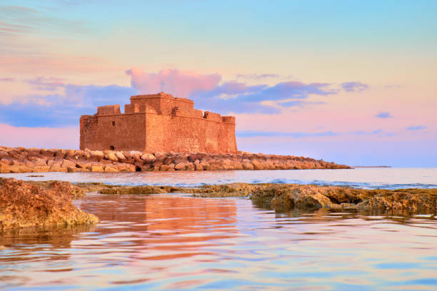 Pafos Harbour Castle (Turkish Castle) in Pathos, Cyprus, on a sunset