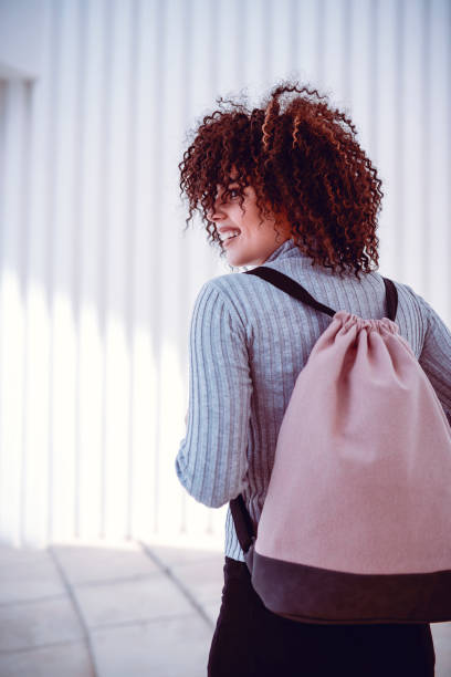istock Female Student Walking In Circle With Backpack 971216482