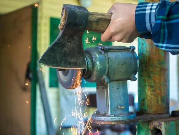 grinding axe with sparks close up