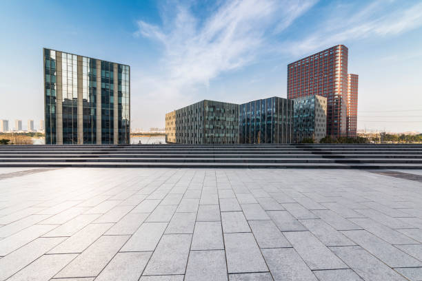 istock Panoramic skyline and modern business office buildings with empty road,empty concrete square floor 971222122