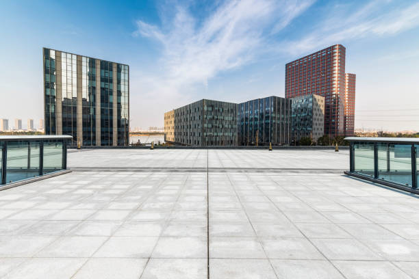 istock Panoramic skyline and modern business office buildings with empty road,empty concrete square floor 971224198
