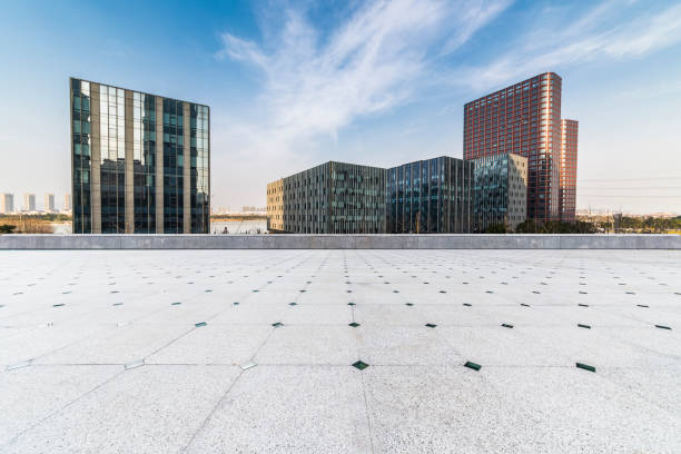 istock Panoramic skyline and modern business office buildings with empty road,empty concrete square floor 971224548