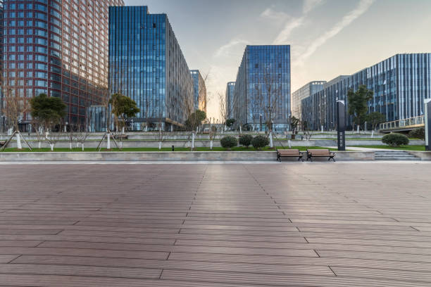 istock Panoramic skyline and modern business office buildings with empty road,empty concrete square floor 971224674