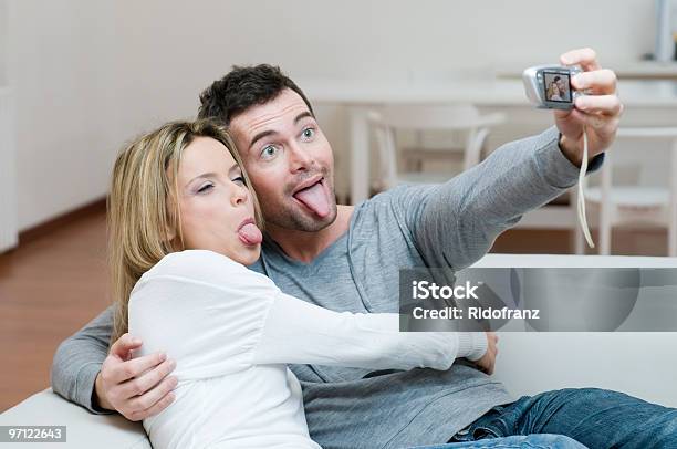 Young Couple Making Faces And Photo Stock Photo - Download Image Now - Adult, Adults Only, Beautiful People