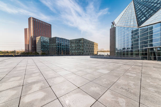 istock Panoramic skyline and modern business office buildings with empty road,empty concrete square floor 971227420