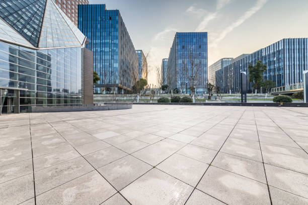 istock Panoramic skyline and modern business office buildings with empty road,empty concrete square floor 971230236