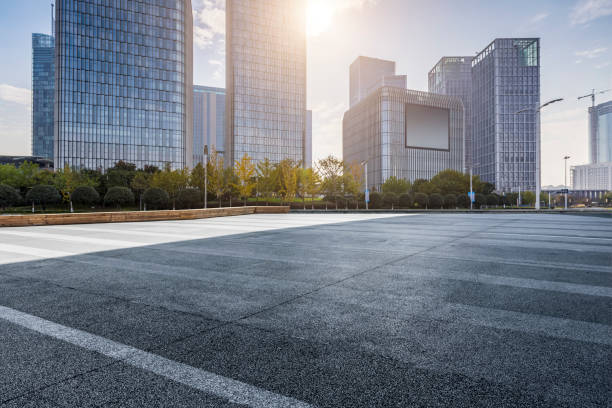 istock Panoramic skyline and modern business office buildings with empty road,empty concrete square floor 971230380