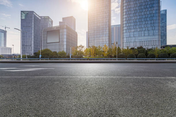 istock Panoramic skyline and modern business office buildings with empty road,empty concrete square floor 971230382