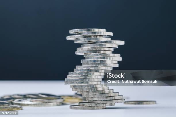 Unstable Closed To Collapse Stack Of Coins Tower Uncertainty Of Business Risk Of Financial Or Investment No Stability Problem Or Crisis Concept Stock Photo - Download Image Now