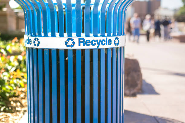 istock Blue recycling bin with universal recycle symbol 971235938