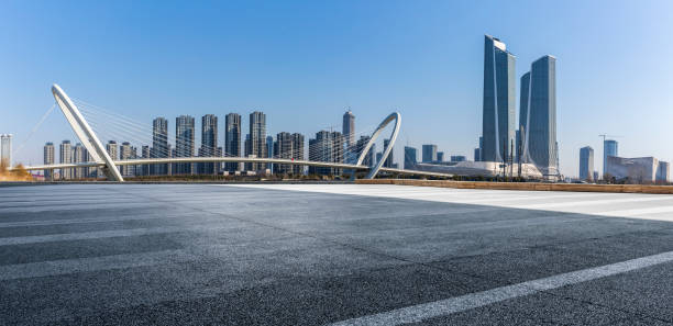 istock Panoramic skyline and modern business office buildings with empty road,empty concrete square floor 971238664