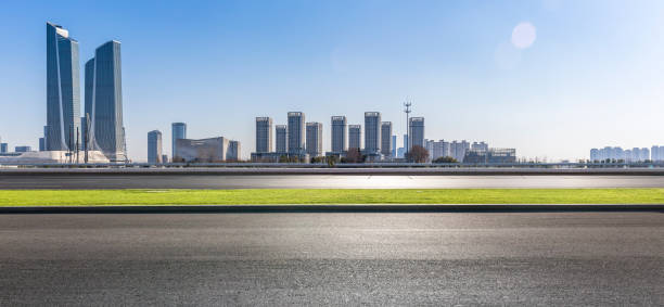 istock Panoramic skyline and modern business office buildings with empty road,empty concrete square floor 971238860