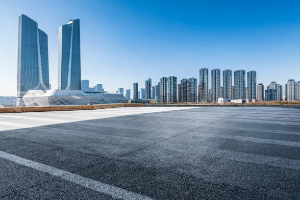 istock Panoramic skyline and modern business office buildings with empty road,empty concrete square floor 971240758