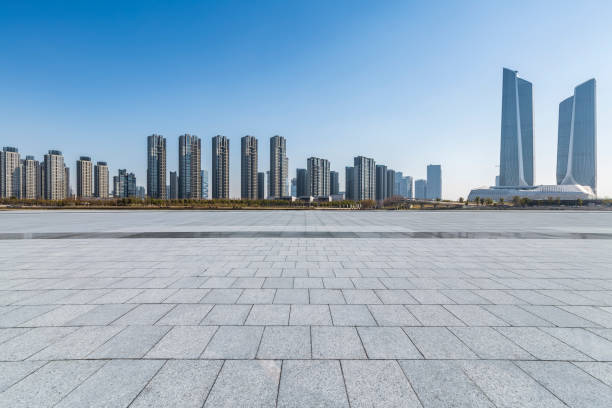istock Panoramic skyline and modern business office buildings with empty road,empty concrete square floor 971241442