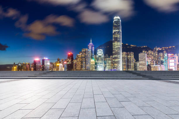 istock Panoramic skyline and modern business office buildings with empty road,empty concrete square floor 971243662