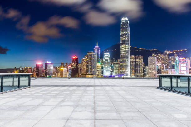 istock Panoramic skyline and modern business office buildings with empty road,empty concrete square floor 971243744