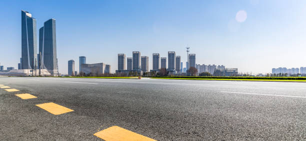istock Panoramic skyline and modern business office buildings with empty road,empty concrete square floor 971243784