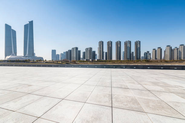 istock Panoramic skyline and modern business office buildings with empty road,empty concrete square floor 971243848