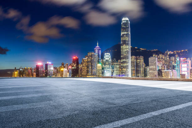 istock Panoramic skyline and modern business office buildings with empty road,empty concrete square floor 971244056