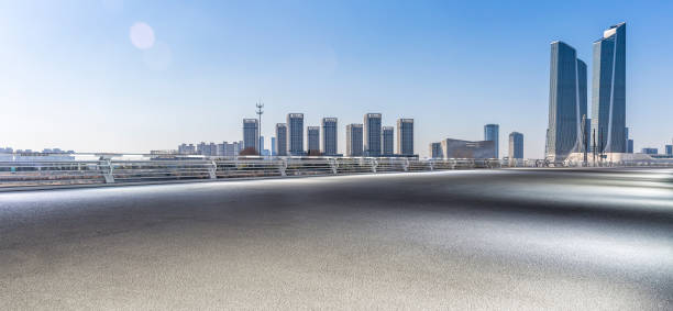 istock Panoramic skyline and modern business office buildings with empty road,empty concrete square floor 971246392
