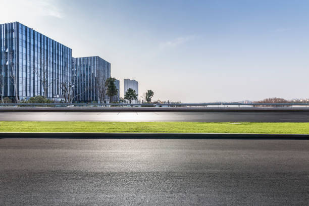 istock Panoramic skyline and modern business office buildings with empty road,empty concrete square floor 971246396