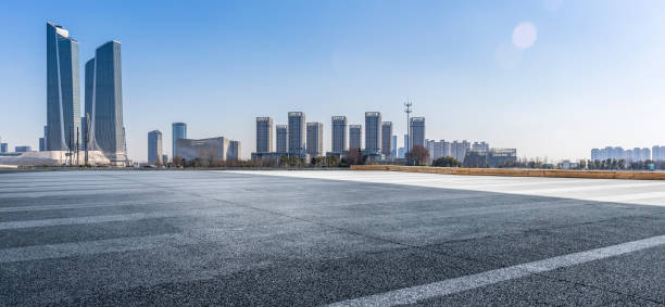 istock Panoramic skyline and modern business office buildings with empty road,empty concrete square floor 971246580