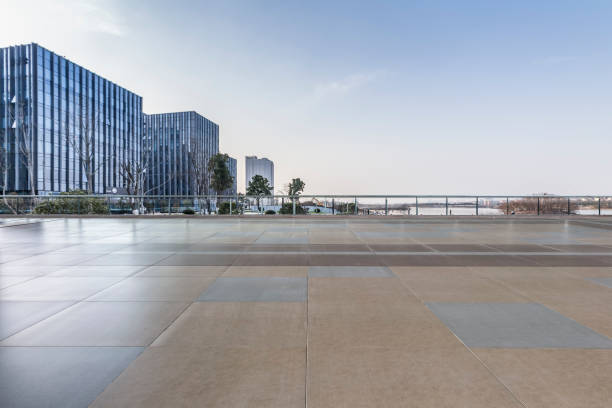 istock Panoramic skyline and modern business office buildings with empty road,empty concrete square floor 971249670