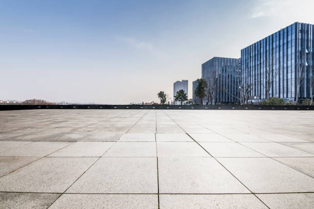 istock Panoramic skyline and modern business office buildings with empty road,empty concrete square floor 971250088