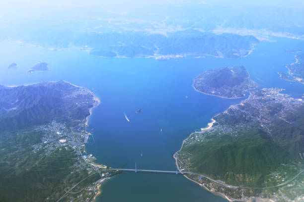 istock Aerial view of plane window looking down japan 971253176