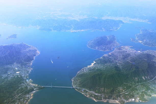 istock Aerial view of plane window looking down japan 971253344