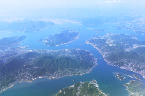 istock Aerial view of plane window looking down japan 971253398