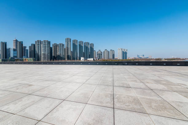 istock Panoramic skyline and modern business office buildings with empty road,empty concrete square floor 971253430
