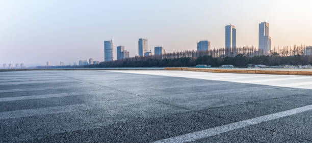 istock Panoramic skyline and modern business office buildings with empty road,empty concrete square floor 971253832