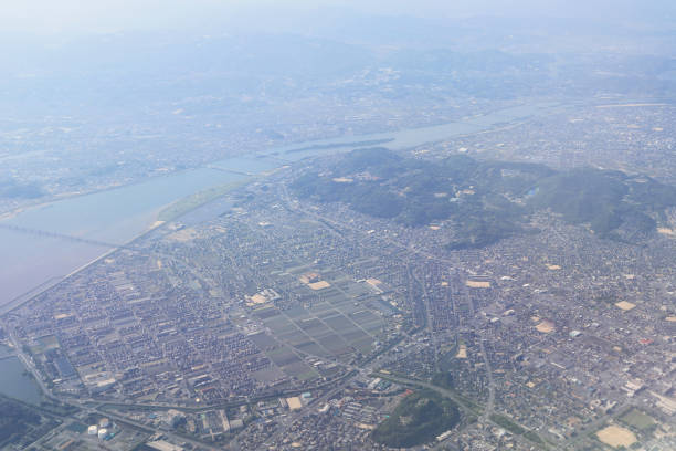 istock Aerial view of plane window looking down japan 971254968