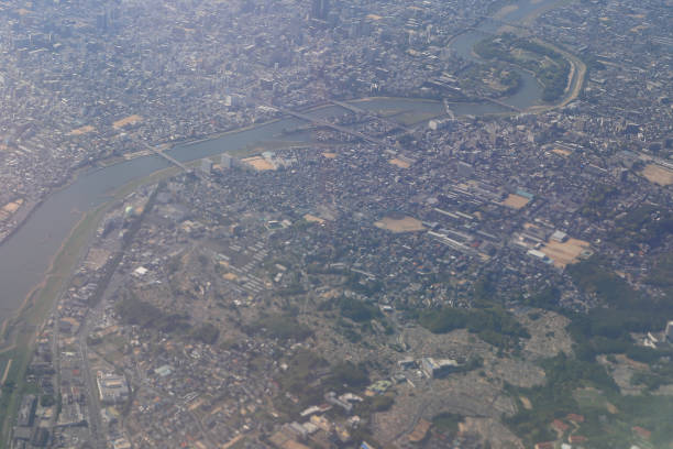 istock Aerial view of plane window looking down japan 971256180