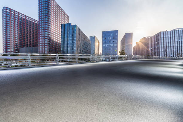 istock Panoramic skyline and modern business office buildings with empty road,empty concrete square floor 971256482