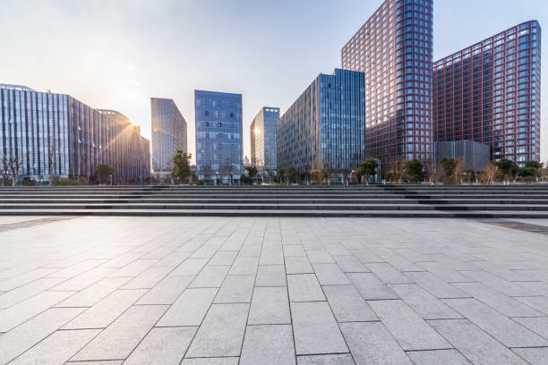 istock Panoramic skyline and modern business office buildings with empty road,empty concrete square floor 971256492
