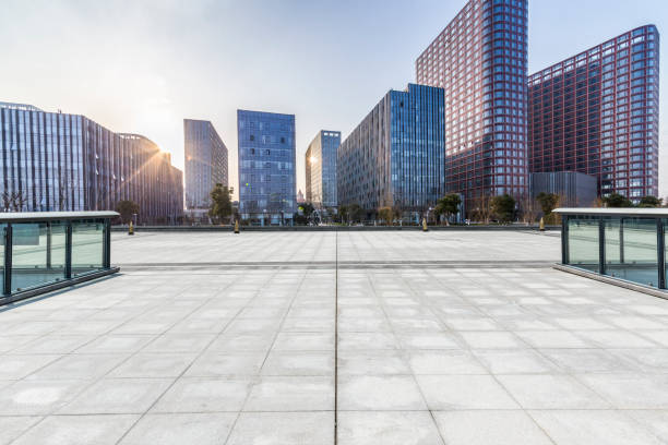 istock Panoramic skyline and modern business office buildings with empty road,empty concrete square floor 971256602